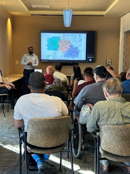 A project representative gives a presentation to community members.